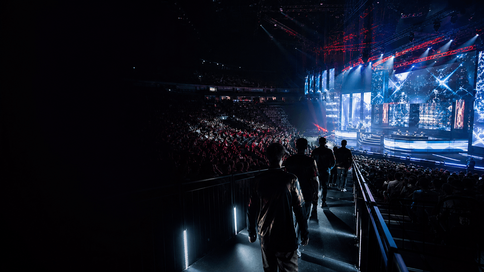 Esports players entering a packed Counter-Strike arena